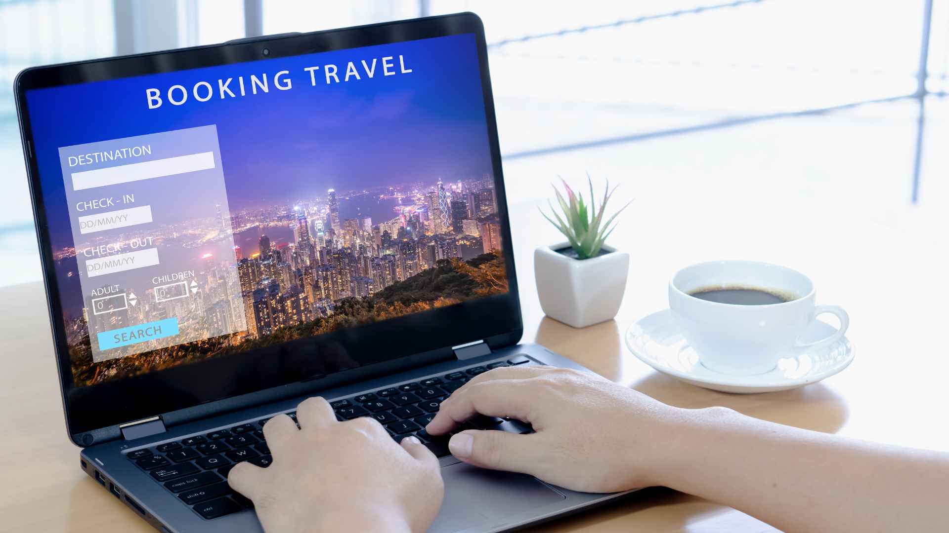 A photo of someone at a computer researching travel Valhalla Travel