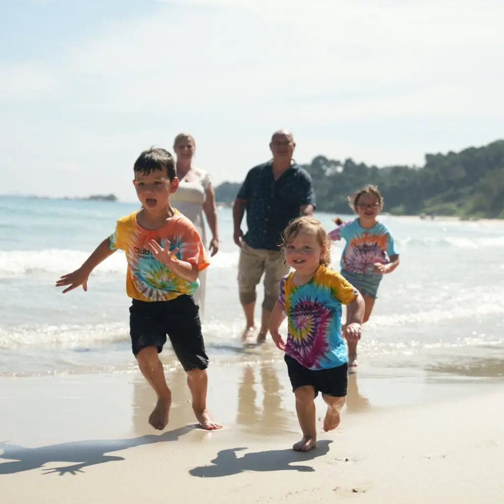 Nick, Becky and the kids having fun on the beach at Club Med Bintan organised by Valhalla Travel
